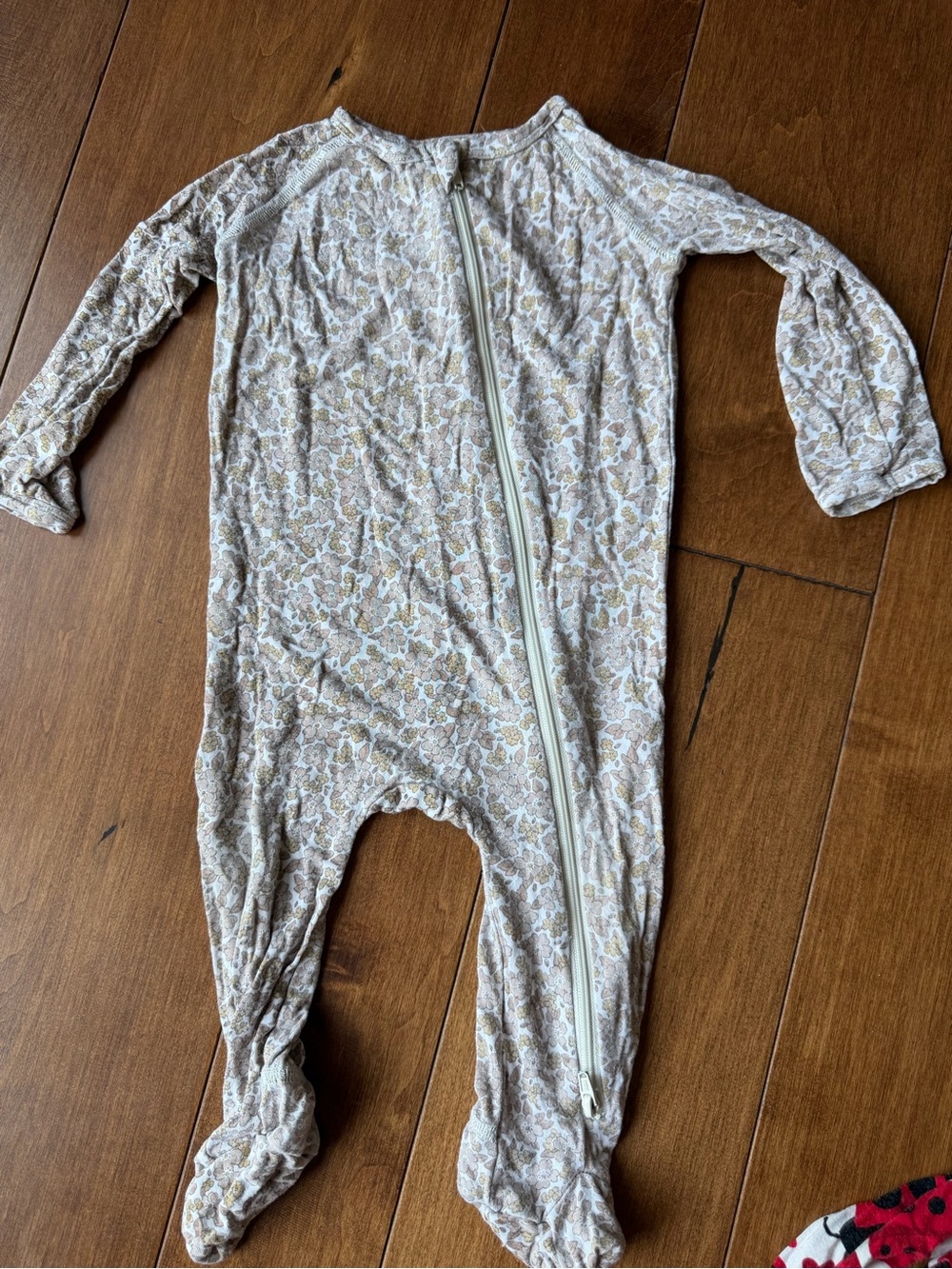 Rylee + Cru Neutral Floral Footed Zipper Romper in Beige and Cream